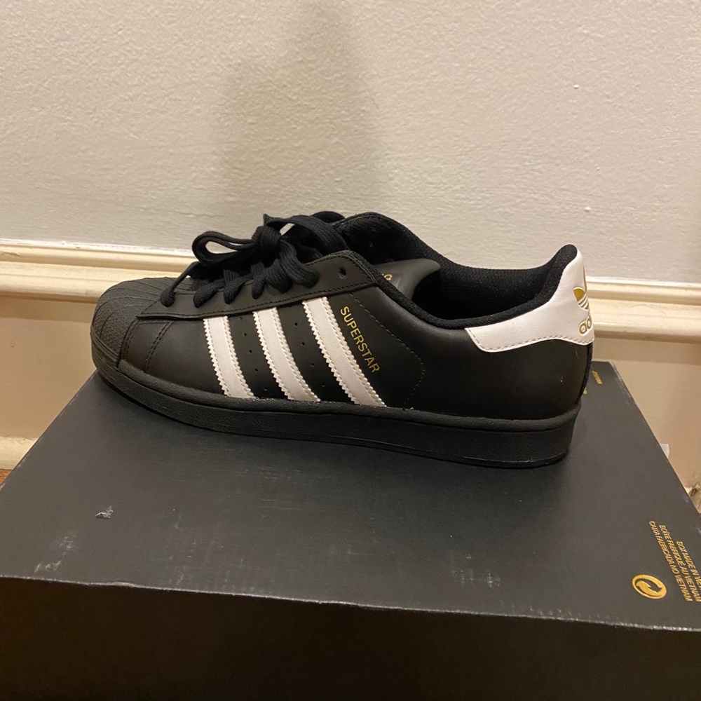 Black and white adidas all-star sneakers